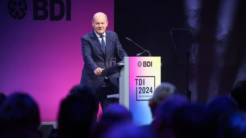 German Chancellor Olaf Scholz speaks at the Day of German Industry 2024 organized by the Federation of German Industries (BDI). The BDI's two-day future conference with representatives from business, politics, science and society is being held this year under the motto "Cohesion in polarized worlds". Bernd von Jutrczenka/dpa